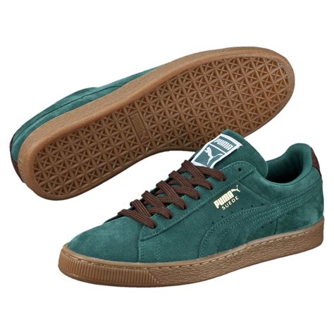 puma green suede sneakers.